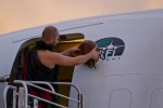 Aukai La'amaikahiki performs a traditional Hawaiian blessing for the inaugural Alaska Airlines flight from Bellingham to Honolulu.