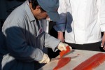Fileting the salmon. (Photo by Tad Carlson)