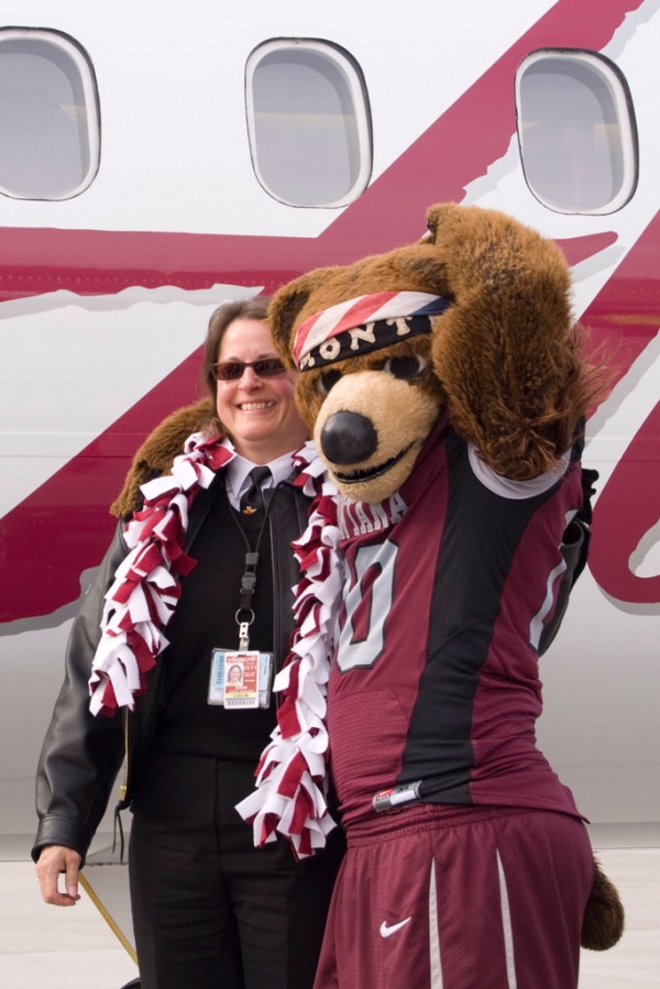 Monte the bear poses with Captain Susan Roy
