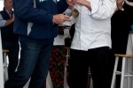 Former Seattle Mariner Jay Buhner presents the gold medal to Pat Donahue of Anthony's Restaurants, champion of the 2012 Alaska Airlines Copper River Cook-Off. (Photo by Jeremy Dwyer-Lindgren/NYCAviation)
