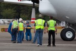 The Museum crew would not know where to align the VIP stages or other preparations until the plane had actually arrived. The door swinging and unloading operations are very sensitive to wind so it would have to be aligned for the conditions as it arrived. Once parked, the stage actually began in earnest. (Photo by Liem Bahneman/NYCAviation)