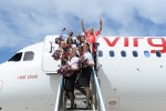 Mayor Michael A. Nutter, Congressman Chaka Fattah and Sir Richard Branson at the top of the air stairs. (Photo by Manny Gonzalez/NYCAviation)