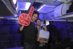 Glenn Howerton and Seth Green pose with the foam finger.  (Photo by Manny Gonzalez/NYCAviation)