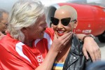 Sir Richard Branson and Amber Rose share a moment on the tarmac. (Photo by Manny Gonzalez/NYCAviation)