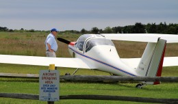 A Burkhart Grob glider (N404DW) basks in the sun at Katama Airpark, Marthas Vineyard, Mass. (Photo by Matt Molnar)