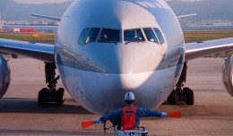 Photo of the Day: A Qatar Airways 777-300ER A7-BAL is directed to its gate at Kansai International Airport in Osaka, Japan