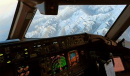 Somewhere over China, a Qatar Airways Boeing 777 makes a banking right turn
