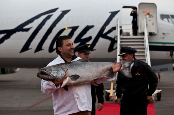Frank Ragusa, general manager of Ocean Beauty Seafoods, holds up the prized salmon to the crowd. (Photo by Jeremy Dwyer-Lindgren/NYCAviation)
