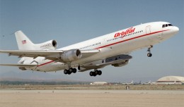 English: Mounted under the fuselage of a modified Lockheed L-1011, the Orbital Sciences X-34 technology demonstrator is taken aloft for its first captive carry flight. (Photo by NASA/Tony Landis)