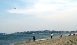 A Southwest Airlines jet on approach to Logan Airport passes over Revere Beach. (Photo by Sara Jeanne Edwards via Flickr, CC BY-NC-SA)