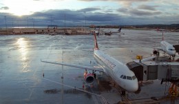 Virgin America jet sits on a rainy tarmac at SFO.