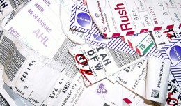 A collection of luggage tags. (Photo by Steve D. via Flickr, CC-BY-NC-SA)