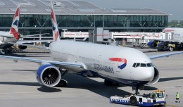 A British Airways Boeing 777-300ER (G-STBF) pushes back from a gate at Heathrow. (Photo by Ken Iwelumo via wikimedia)
