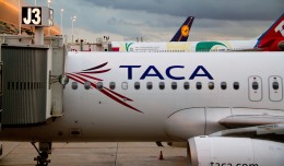 TACA Airbus parked at a gate. (Photo by Frederick Durand via wikimedia, CC-BY-SA)