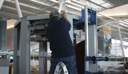 A technician assembles a brand new TSA body scanner. (Photo by Matt Molnar/NYCAviation)